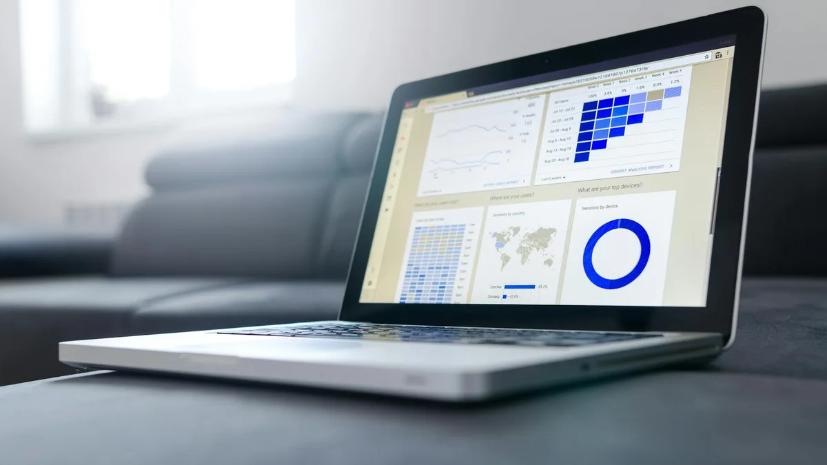 A data dashboard on a monitor, representing the analytics and workflow services agencies build