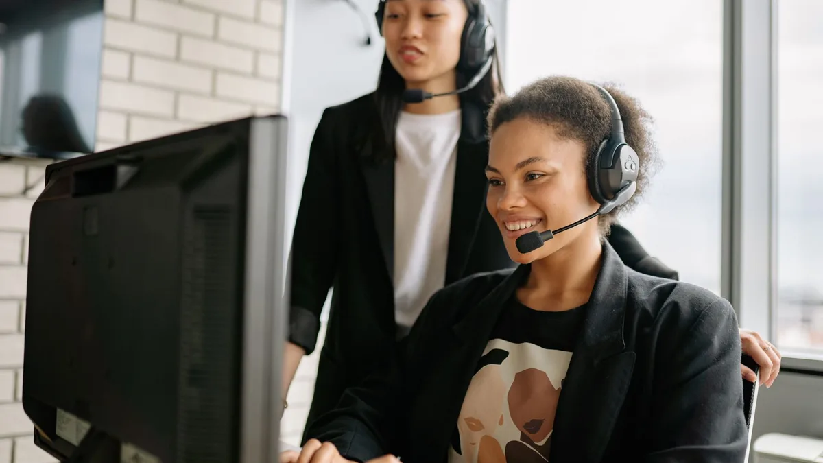 Customer service workspace with headset and computer