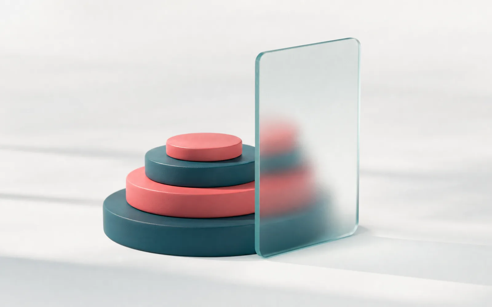 A neat stack of petrol and coral discs beside a glass screen, representing the cost of building a telemedicine app.